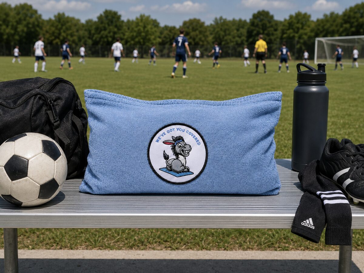 Sweaty Ass Towel on the bench at a soccer field